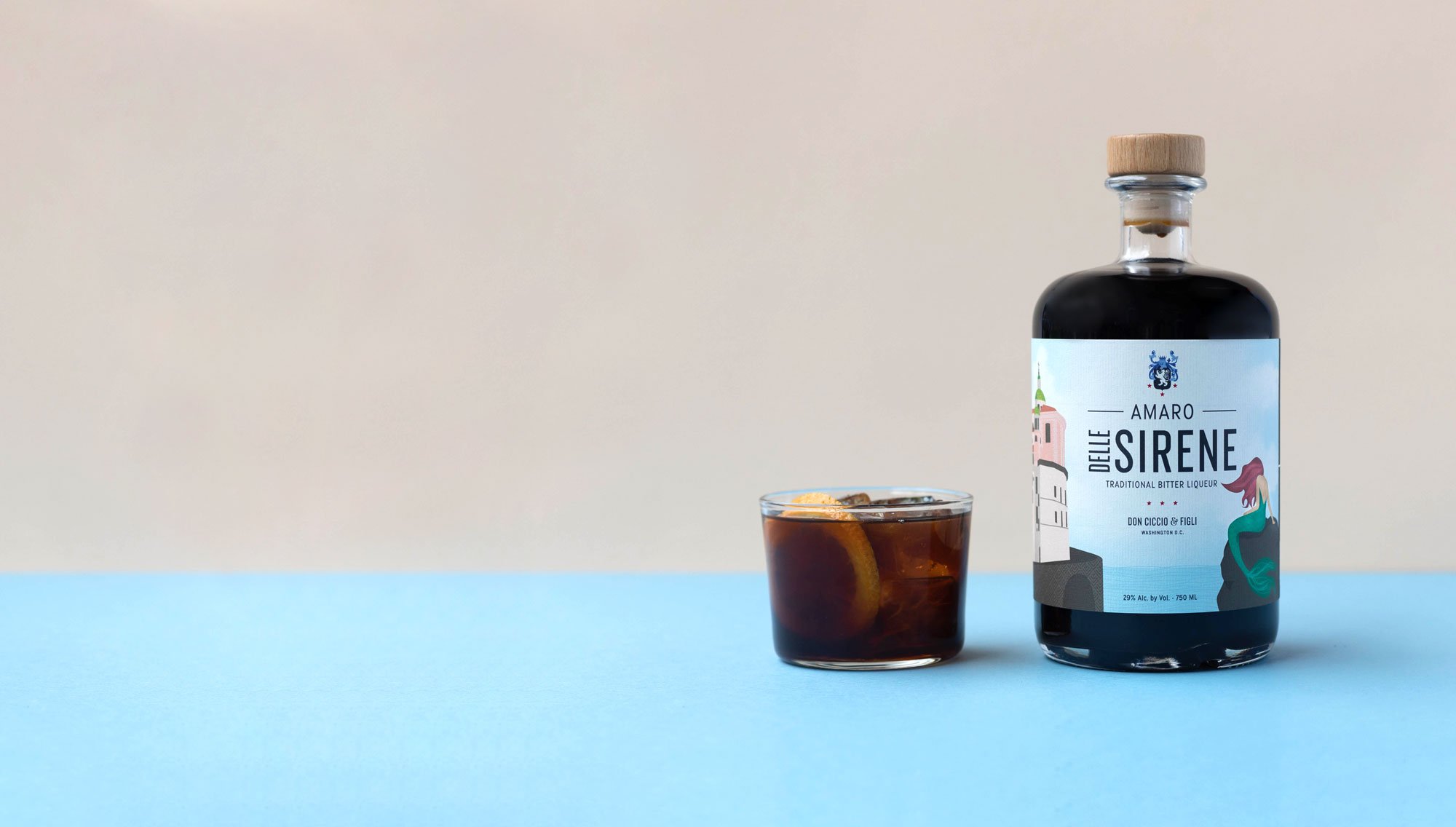 A bottle of amaro with a filled glass