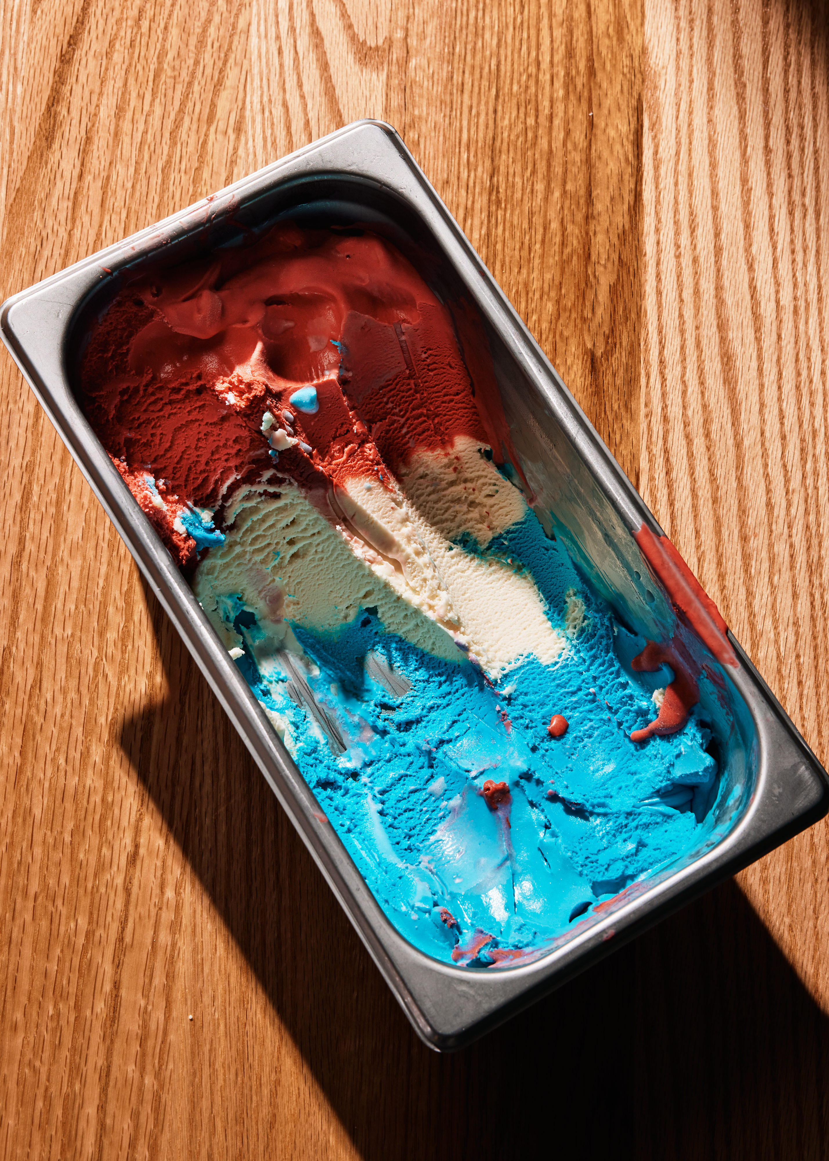 red white and blue ice cream in a metal container