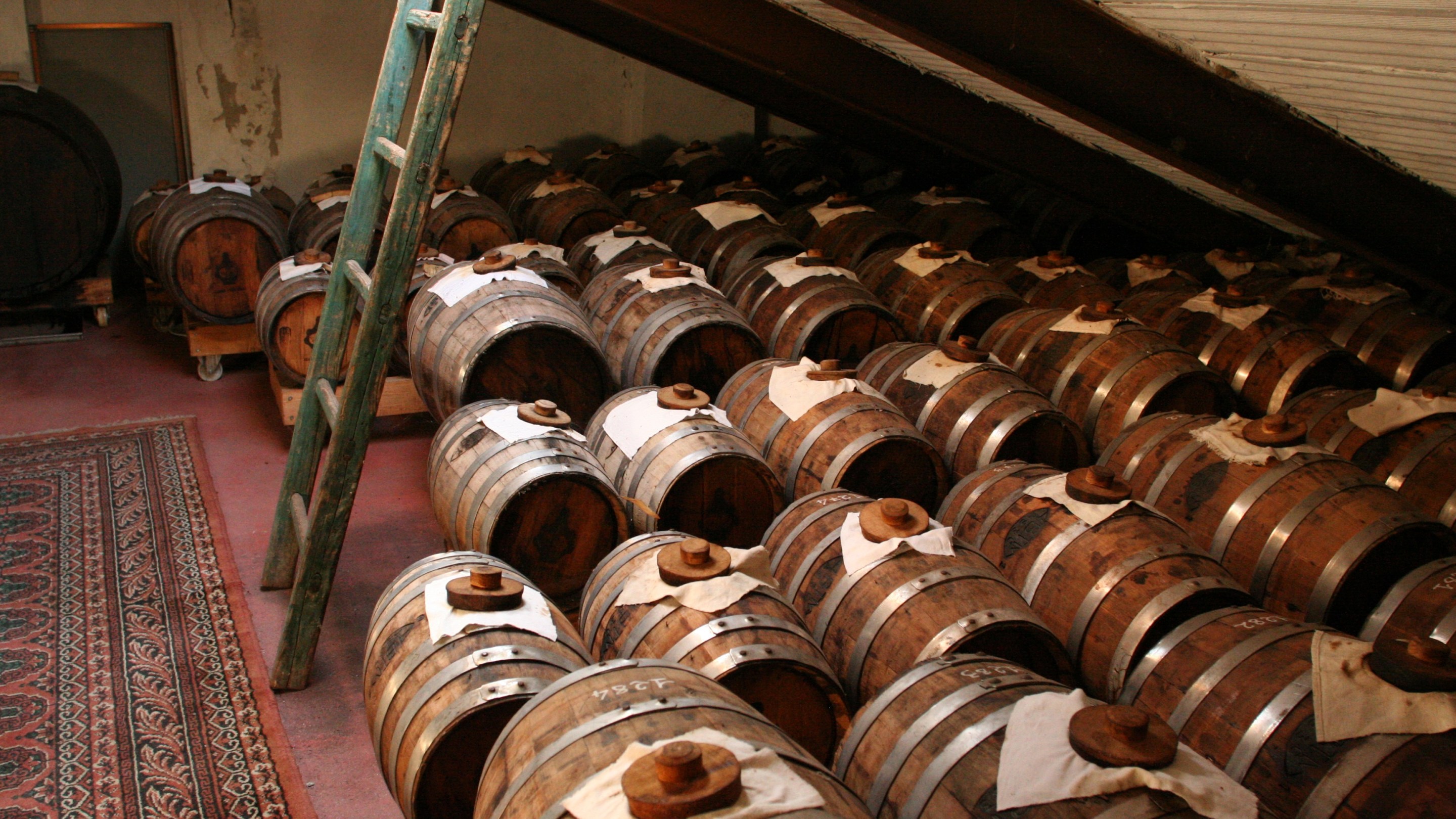 Traditional Balsamic Vinegar aging in oak barrels.