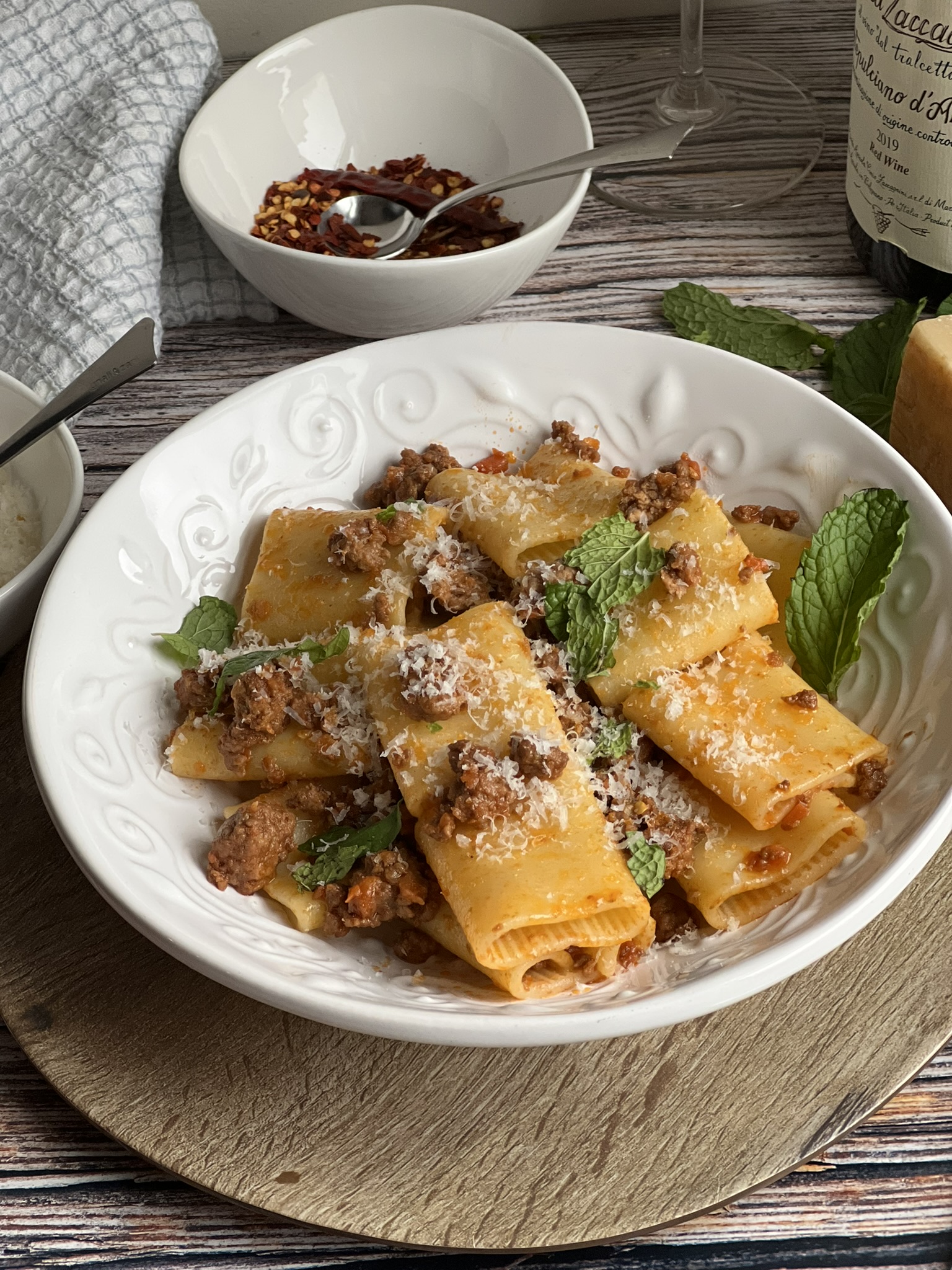 Pasta with a sauce made of lamb and topped with mint