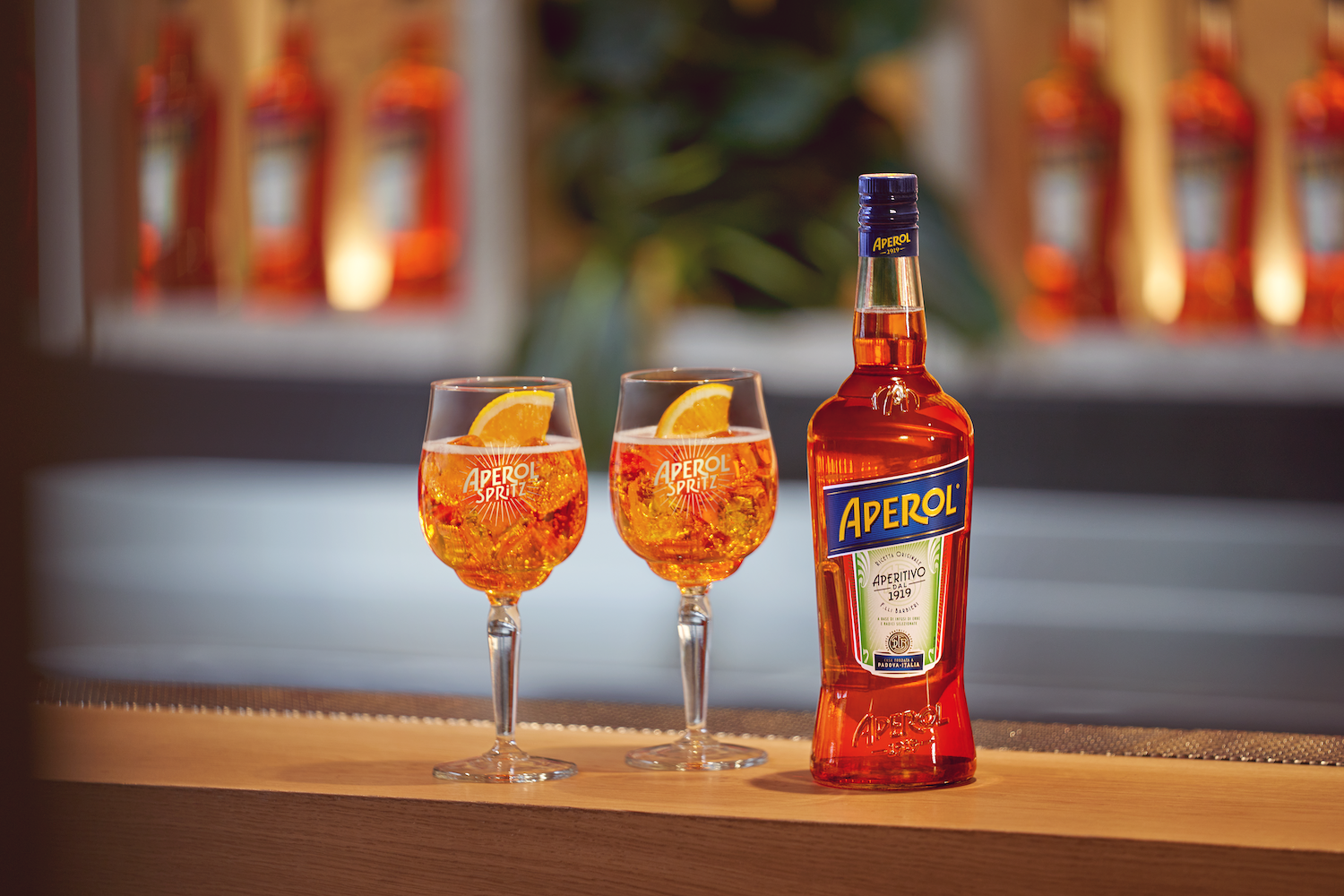 Aperol bottle and 2 glasses
