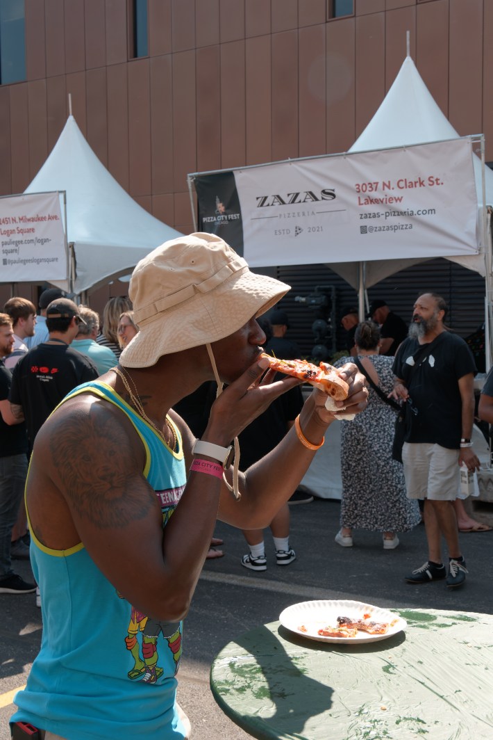 man eating pizza