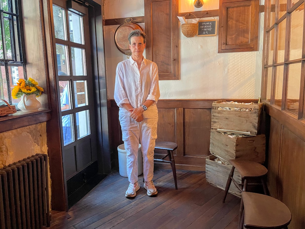 Chef Rita Sodi posing at her restaurant The Commerce Inn.