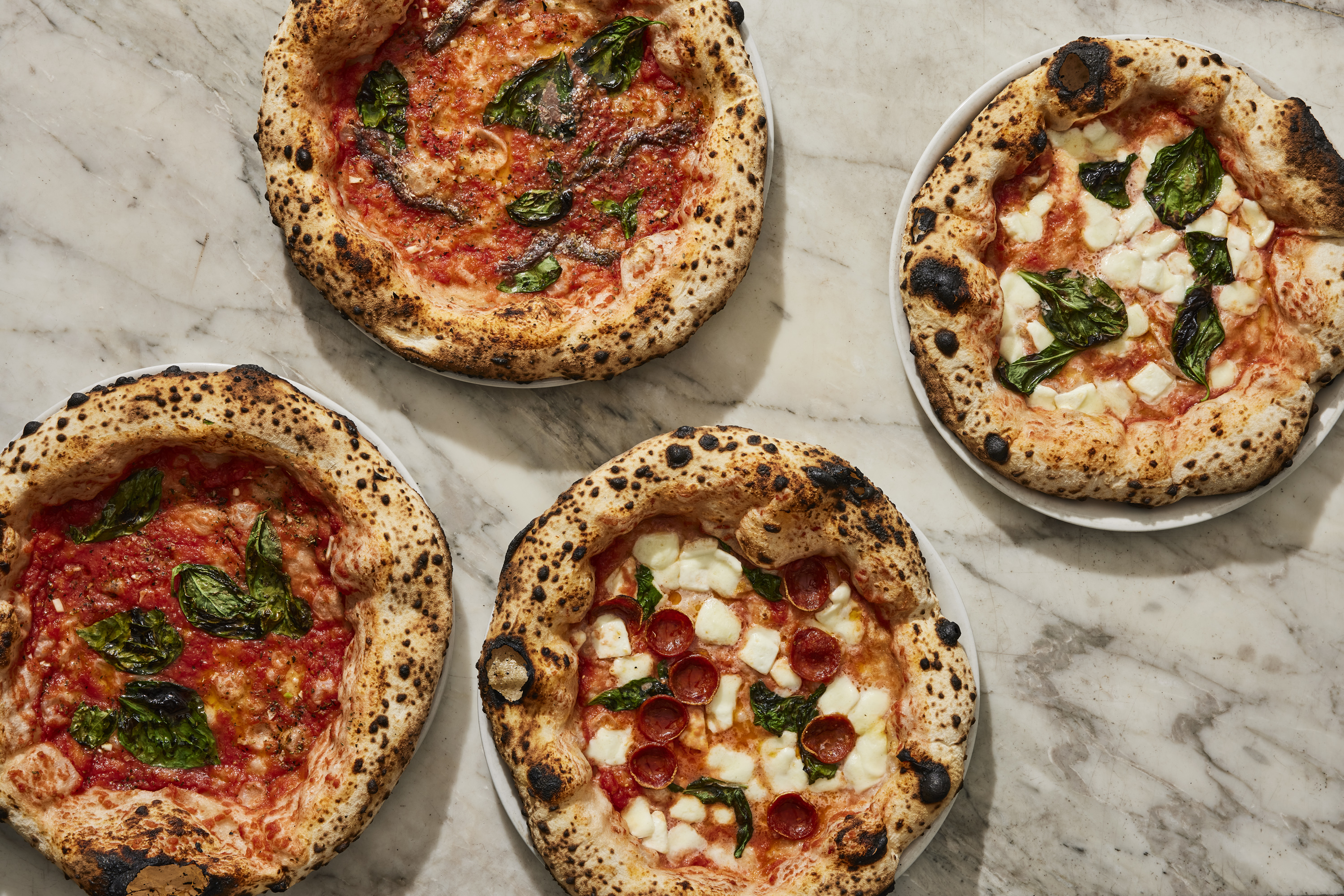 Various pizzas at Una Pizza Napoletana.