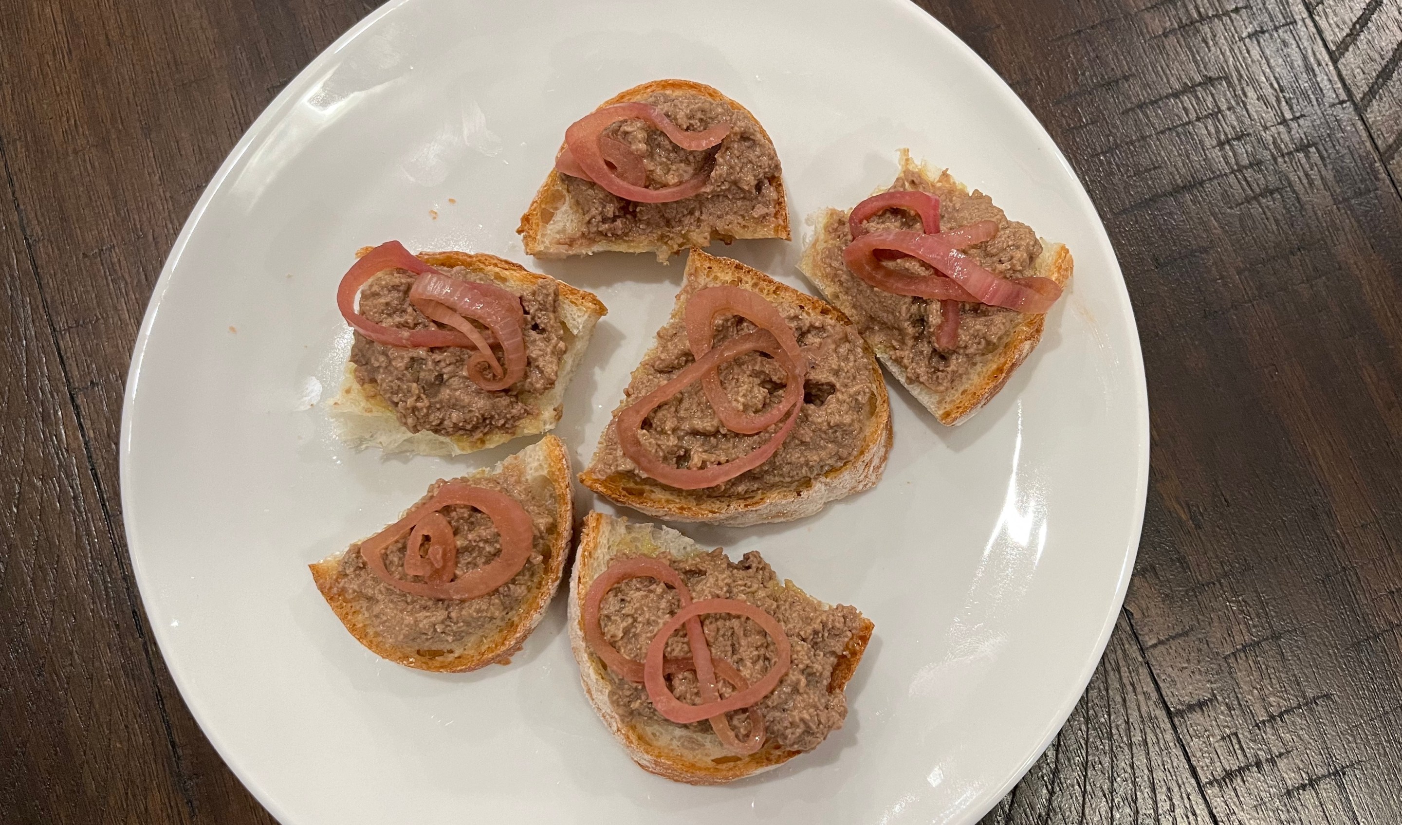 chicken liver crostini with pickled shallots