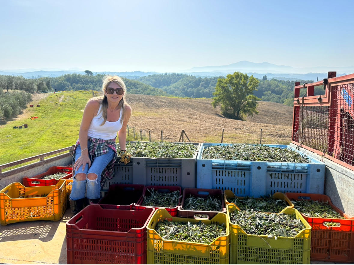 Cookbook author Dena Fenza during the olive harvest on her Tuscan property.