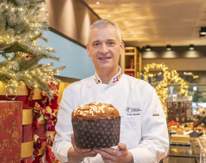 Chef Luigi Biasetto holding one of his award-winning panettone.