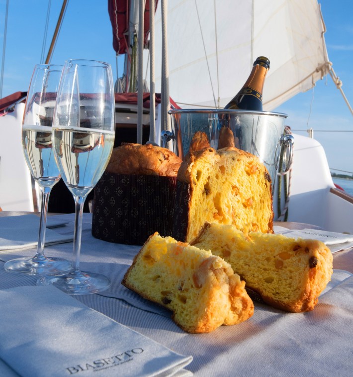 Panettone and sparkling wine on a sailboat.