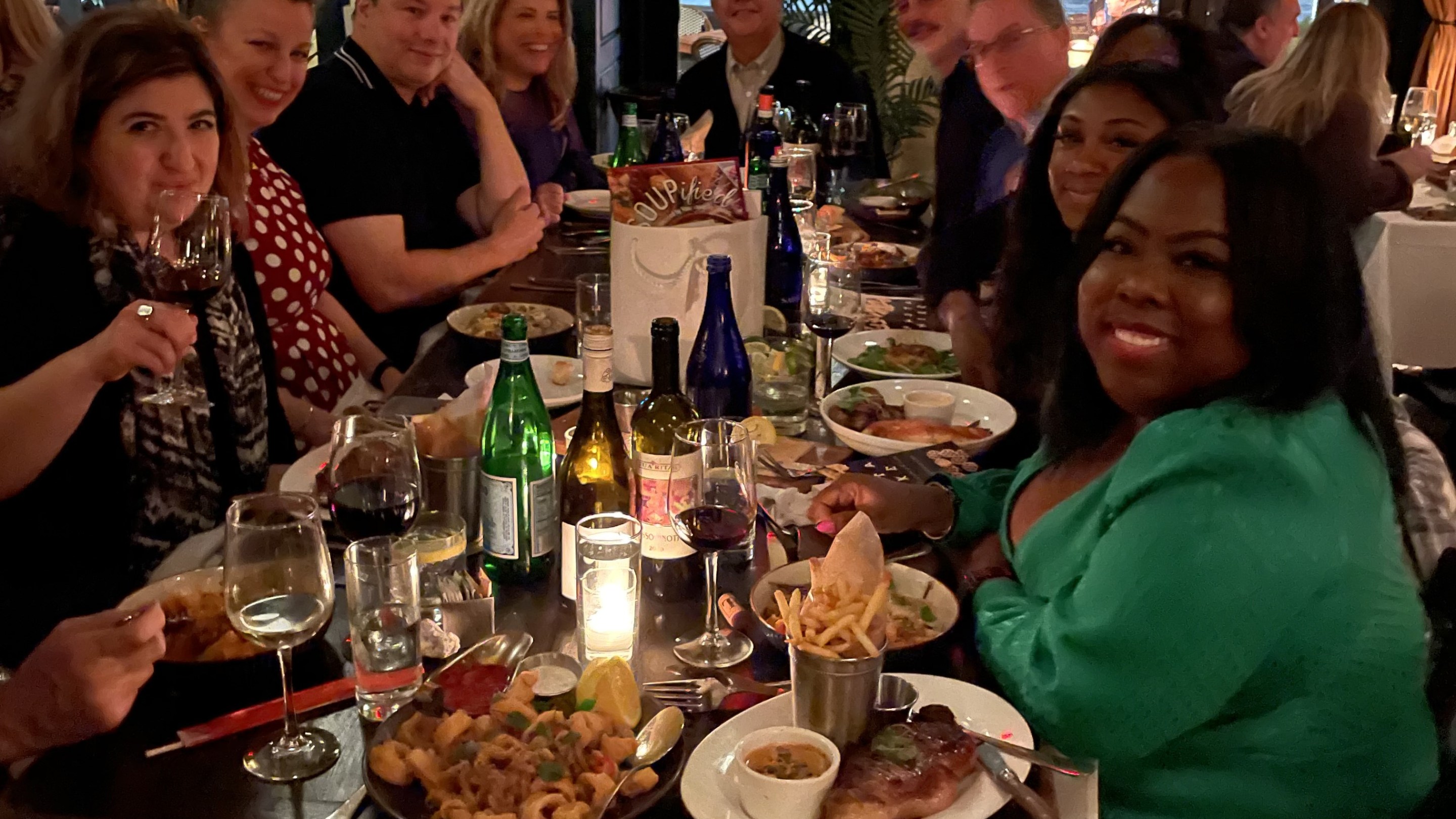 group of people seated at dinner table