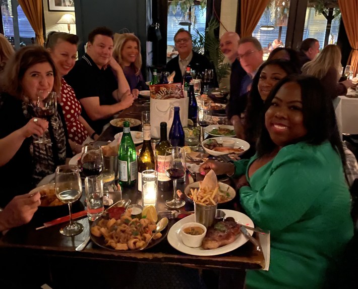 group of people seated at dinner table