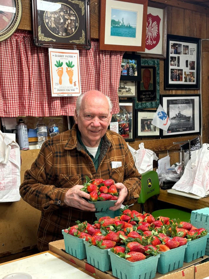Ed “Skeeter” Dombrowski behind the counter at Lee's Farmers Market.