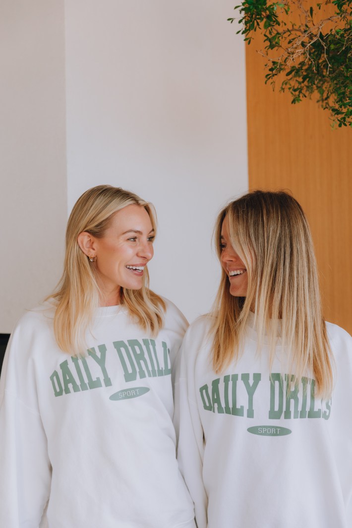 Girls wearing Daily Drills sweatshirts