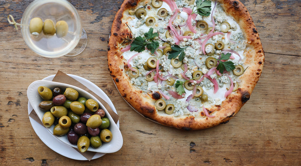 pizza, olives and martini