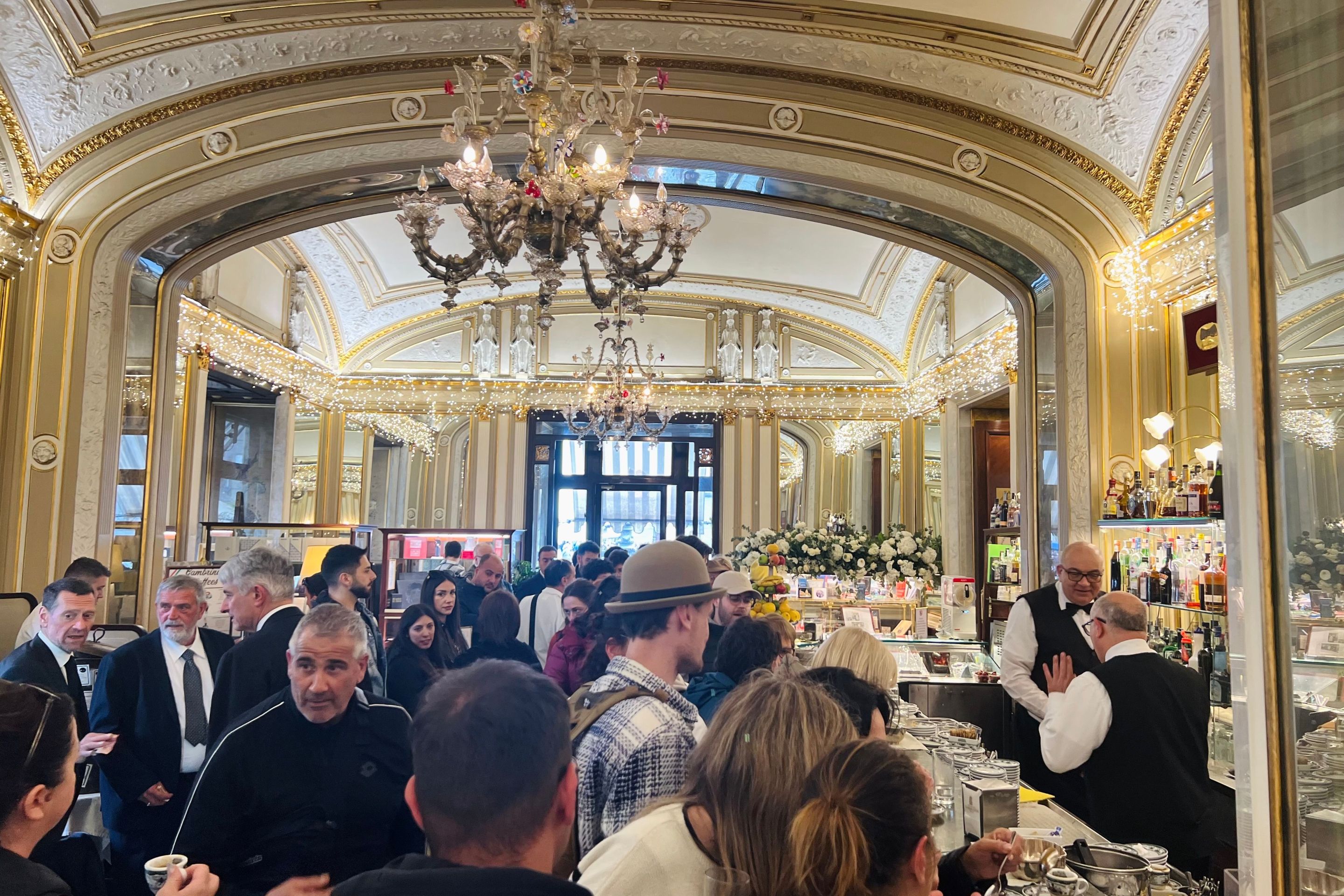 The opulent, crowded interior of Gran Caffè Gambrinus in Naples.