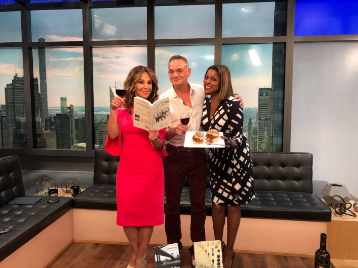 Andrew Cotto sharing food and wine with the hosts of Good Day New York.