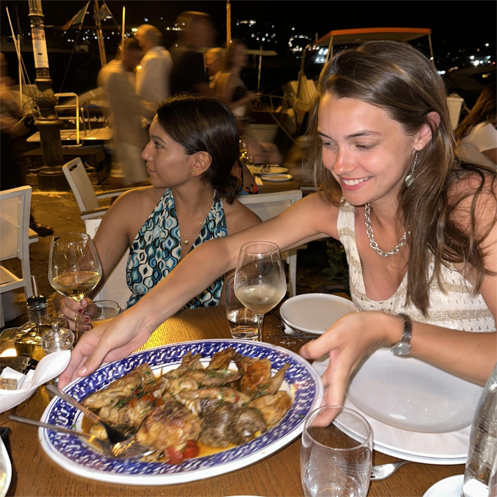 Graceanne LaCombe and a friend with a platter of Coniglio all’ischitana at Tiramisù restaurant.