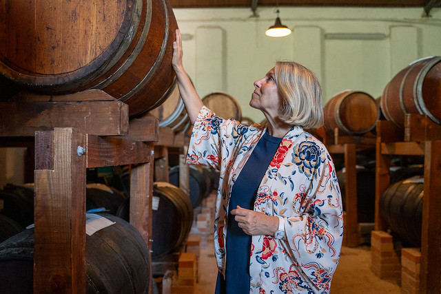 Paula Capaci from Monari Federzoni Balsamic comes to the aging hall to venerate an aging barrel of prized Balsamic Vinegar.