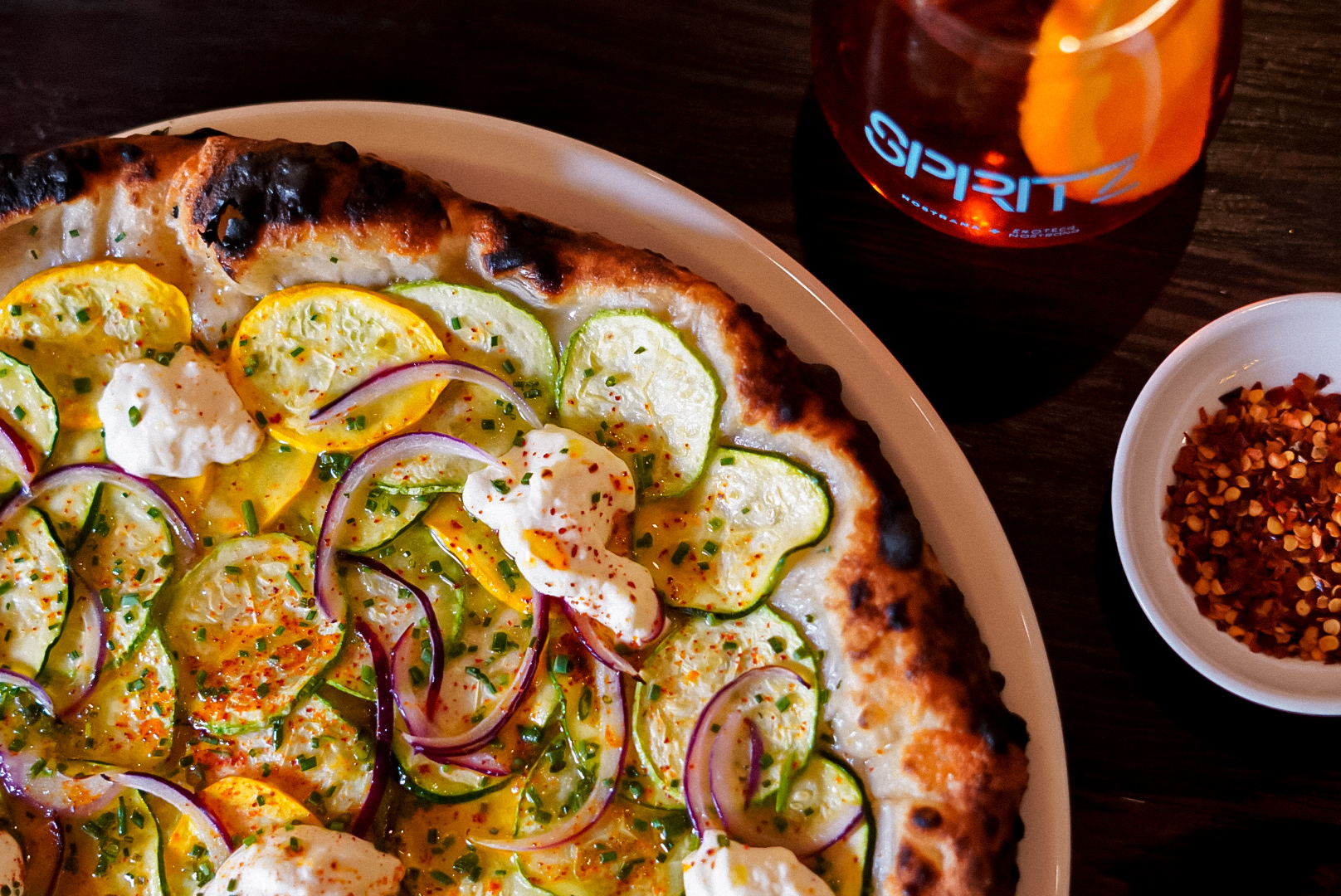 zucchini pizza with peppers and spritz