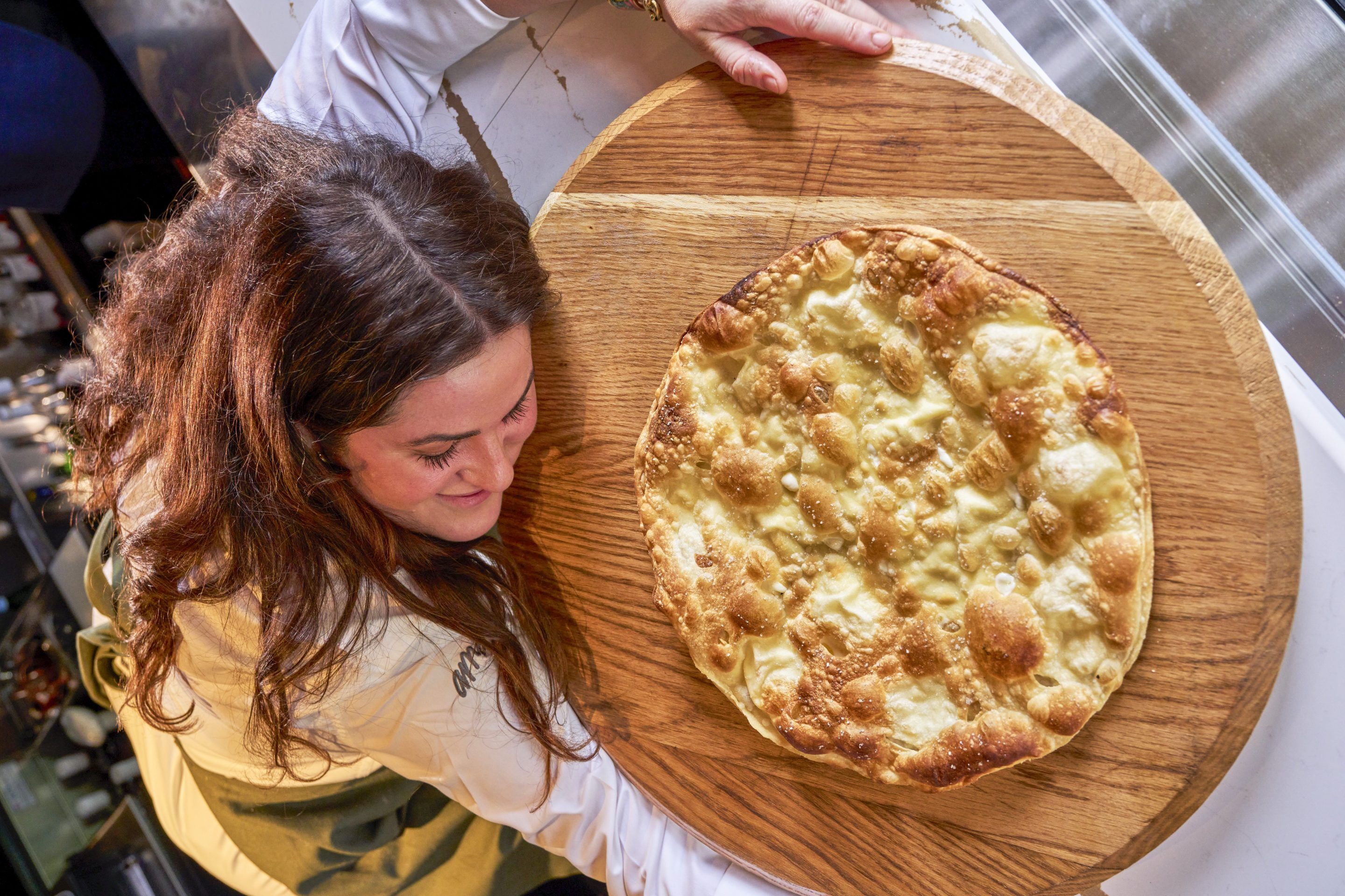 Chef Johanna Hellrigl of Ama restaurant in D.C. with her beloved Focaccia di Recco, a yeast-free focaccia from Liguria.