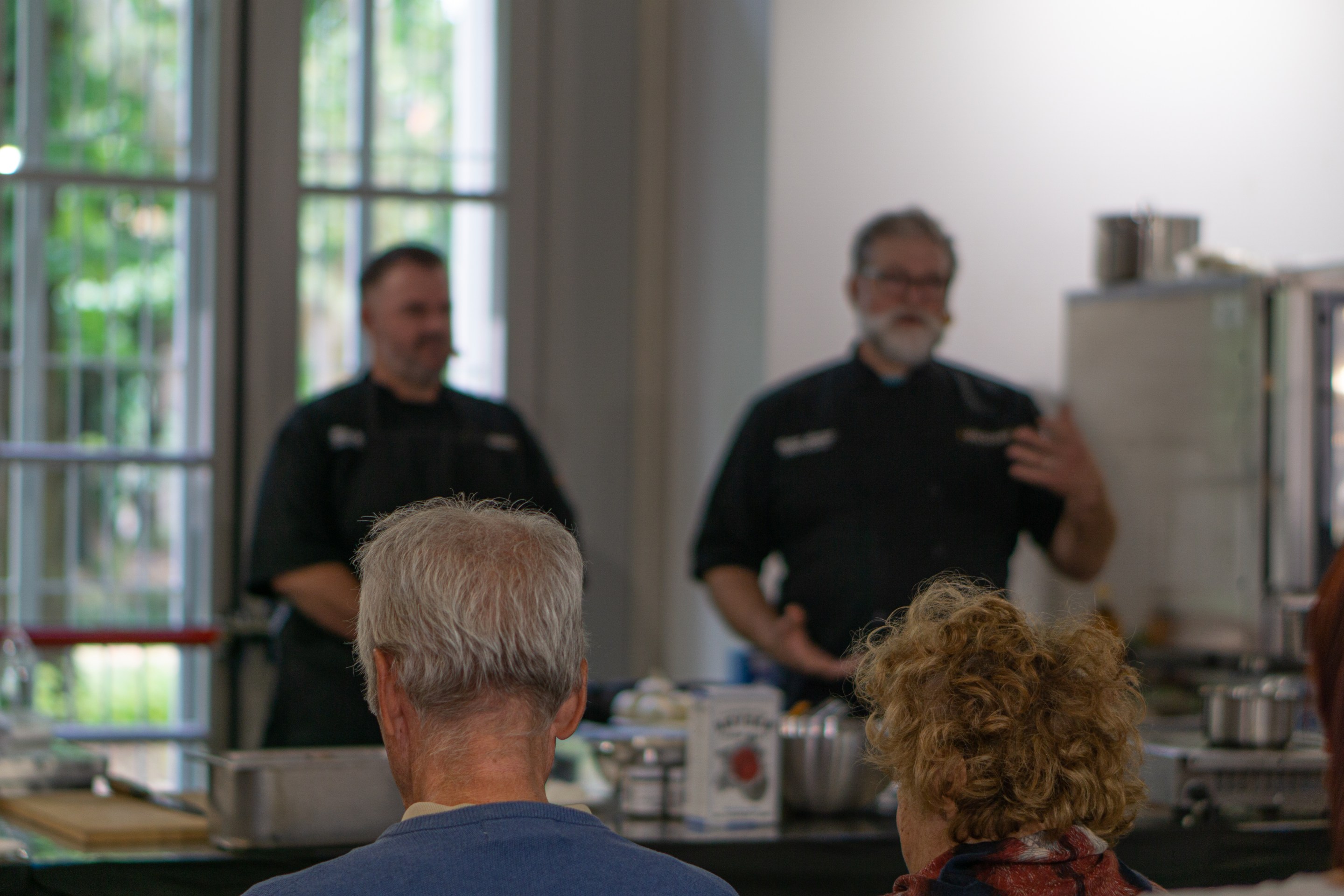 Chefs Matthew Cable and Devon Sanner of restaurant Zio Peppe in Tuscon, AZ, address the audience in Parma, Italy.