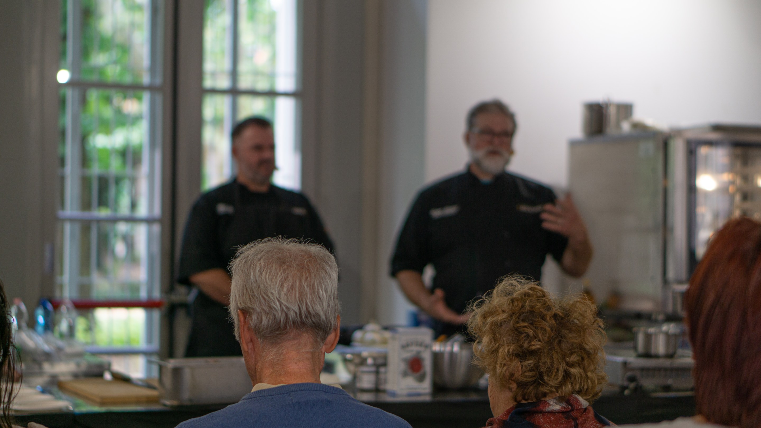 Chefs Matthew Cable and Devon Sanner of restaurant Zio Peppe in Tuscon, AZ, address the audience in Parma, Italy.