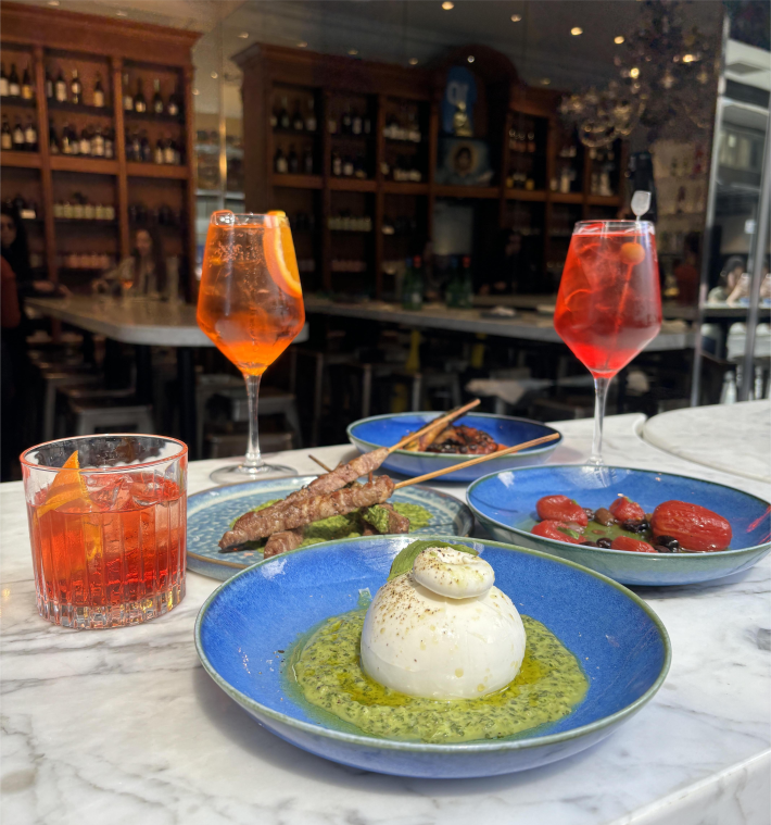 A spread of savory offerings and classic Italian cocktails at David Rocco Bar Aperitivo. Photo provided by David Rocco.