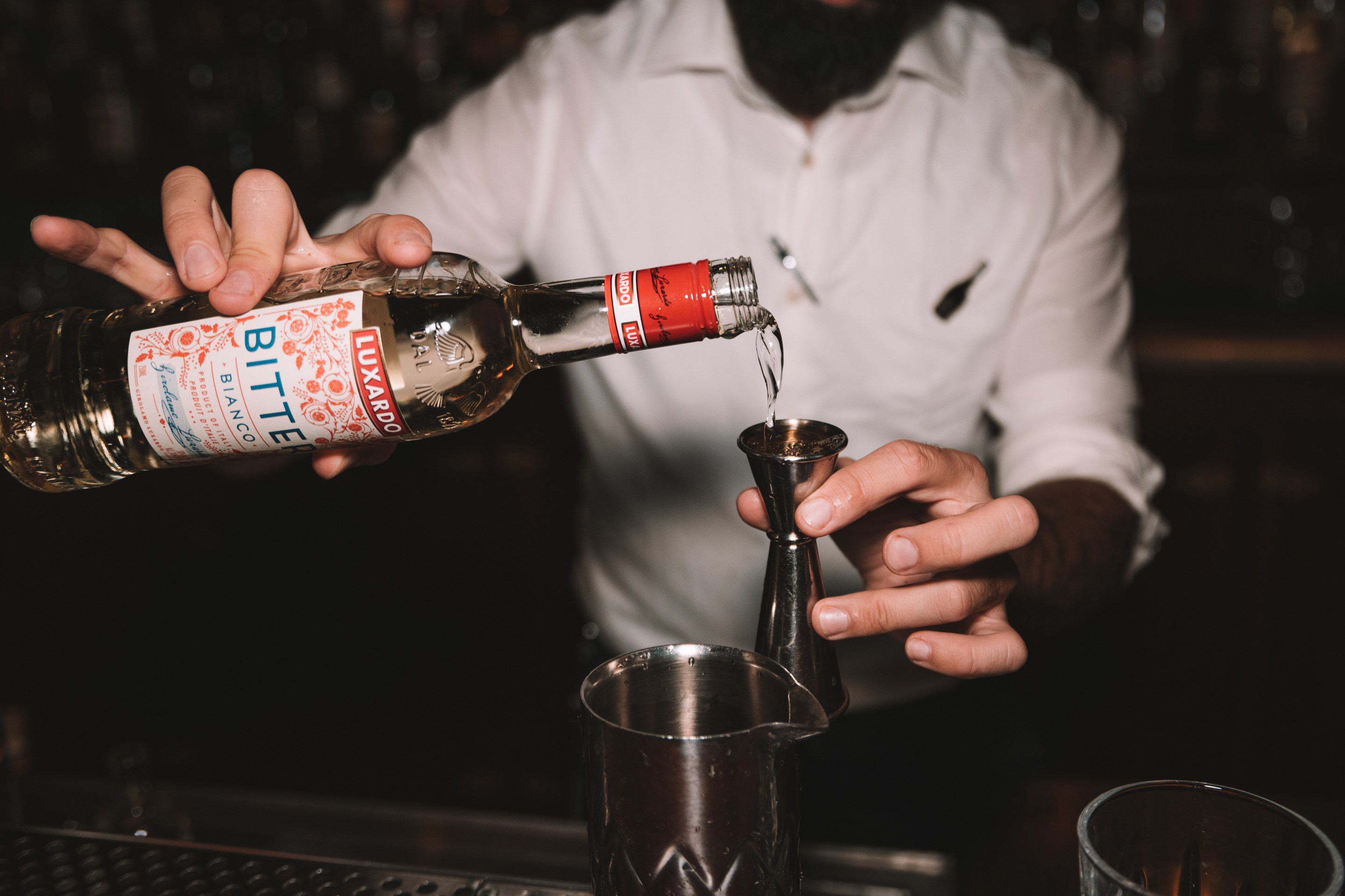 A mixologist using Luxardo's Bitter Bianco.