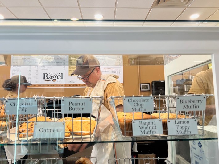 Tony Daddabo behind the counter at his Auburn Bagel Company.