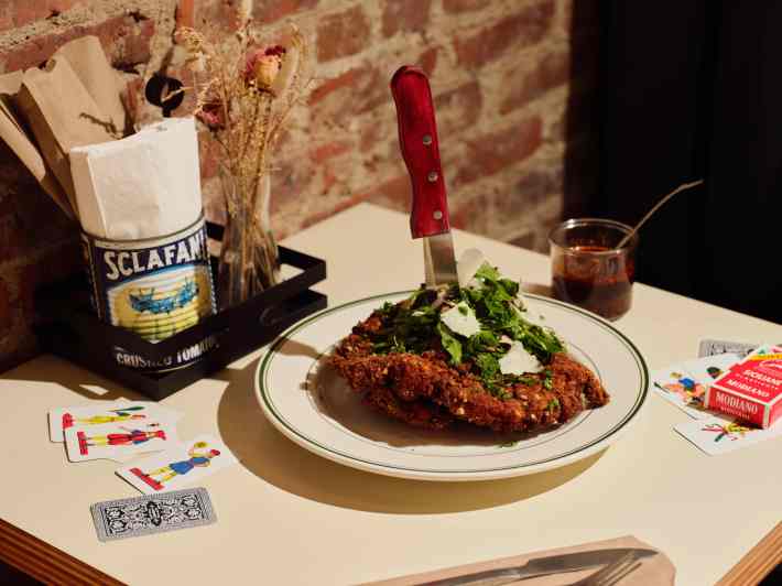 Chicken Milanese with a knife