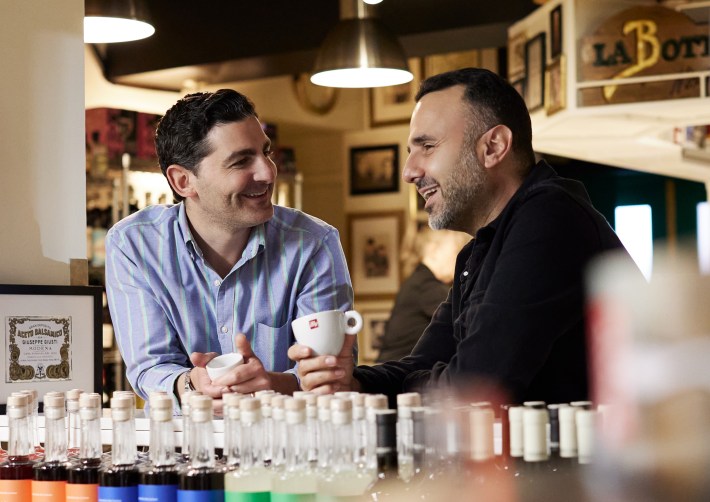 Rocco Jr. and Pat Nicastro enjoying espresso at the coffee bar.