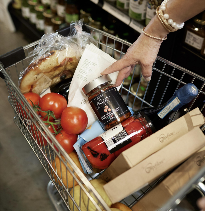 A cart full of groceries at La Bottega Nicastro.