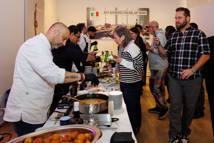 Chef Fabrizio Facchini serving guests at the ITA Talks event.