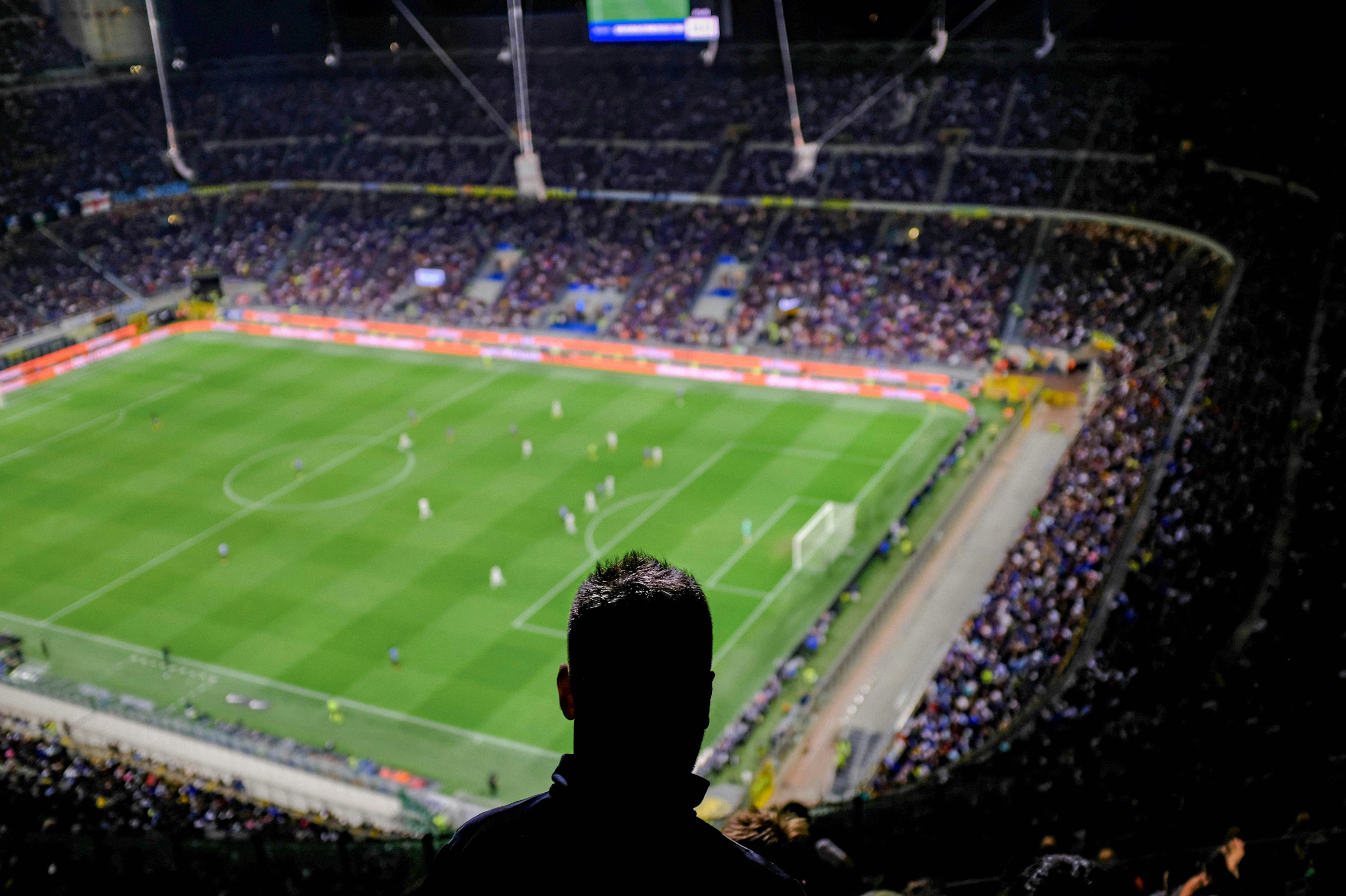 spectator looking down at soccer pitch