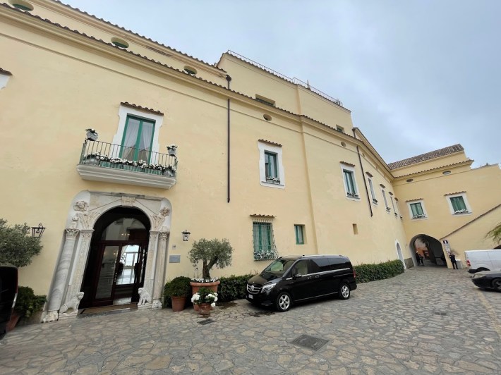 The entrance and exterior facade of Hotel Caruso in the Amalfi Coast town of Ravello.