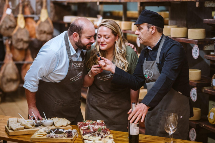 Gaetano "Tano" Mina di Sospiro and his wife Nicole, owners of Bono Events International, preparing for a cheese & charcuterie tasting.