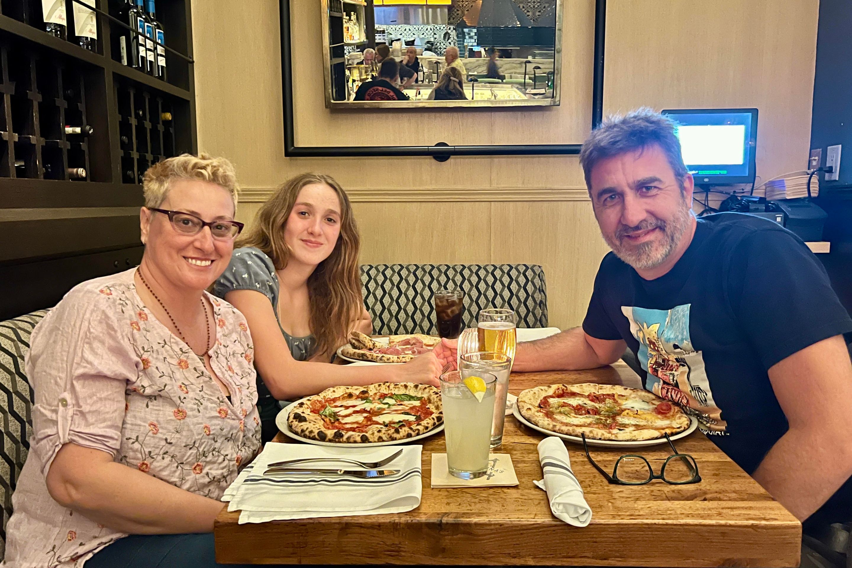 Alessandra "Ale" Gambini (left) with her partner Maurizio Otto and their daughter Angelica.