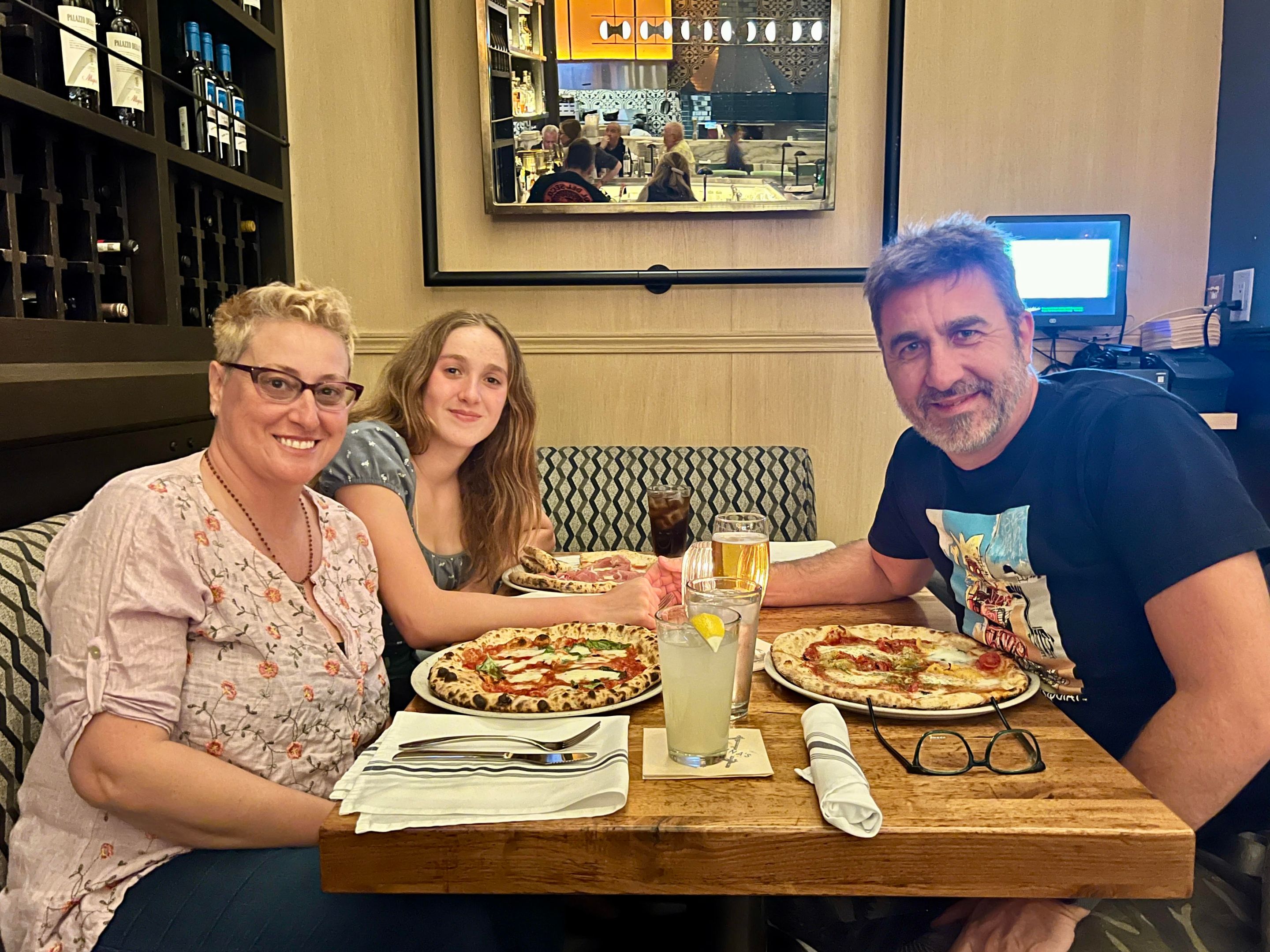 Alessandra "Ale" Gambini (left) with her partner Maurizio Otto and their daughter Angelica.