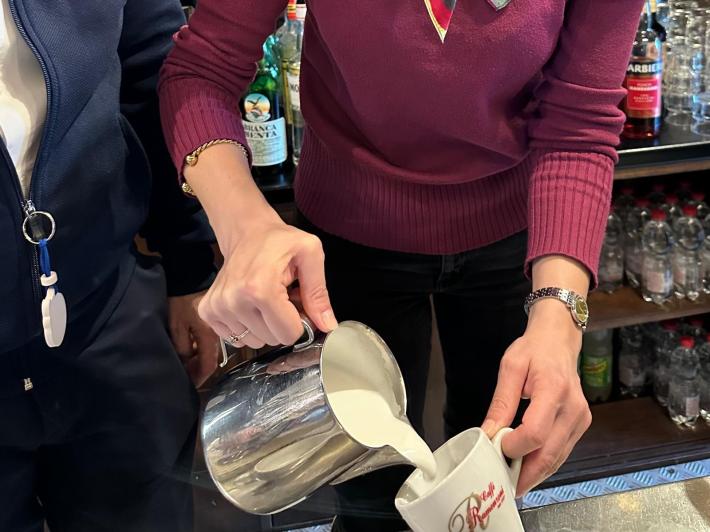 Graceanne LaCombe pouring her warm milk with intention.
