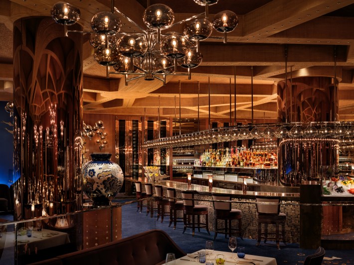 Interior of PISCES at Wynn Las Vegas, featuring Murano glass lighting and bar seating,