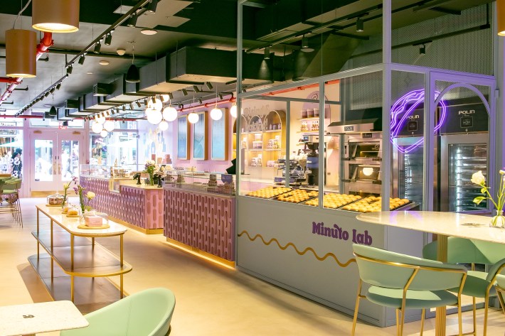 Interior of Minuto Bauli’s Union Square location with baking station and pastel décor.
