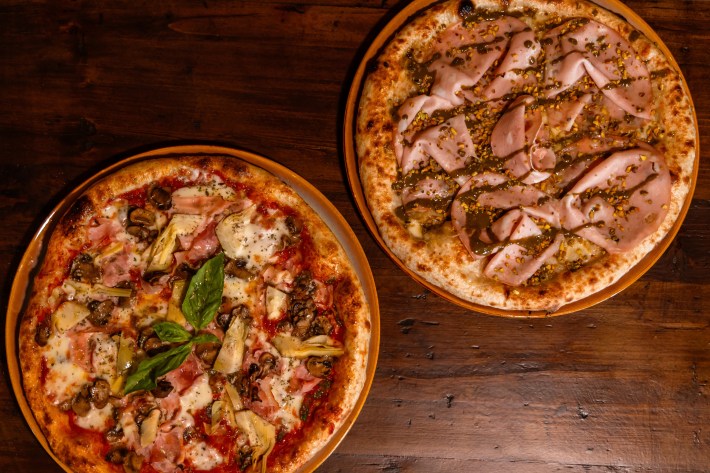 Thin-crust pizzas with toppings like mortadella and pistachio, artichoke and mushrooms.