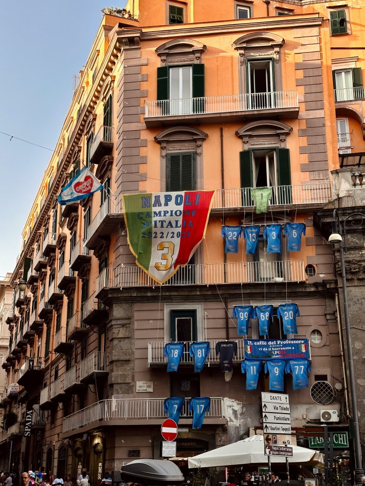 building with Napoli flags