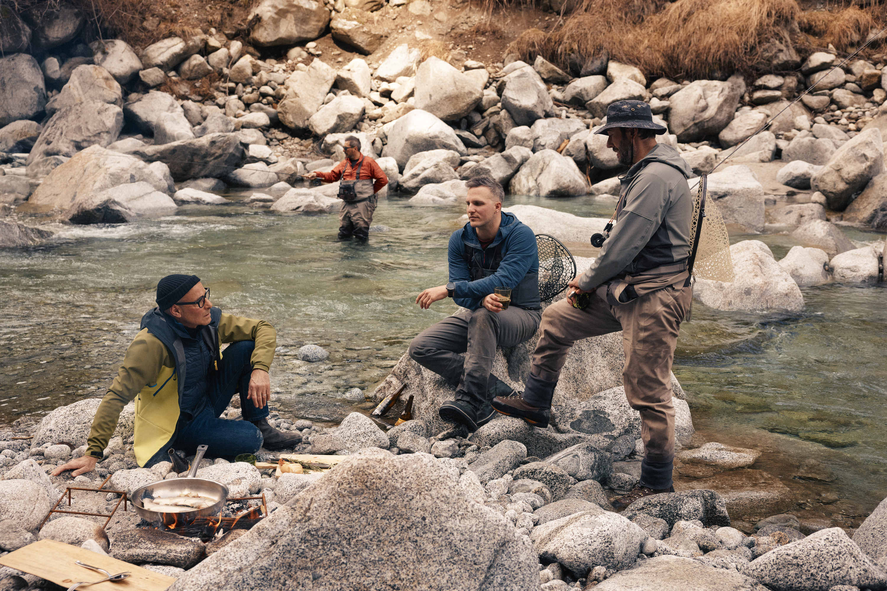 Tucci and locals discussing life in Italy while fishing.