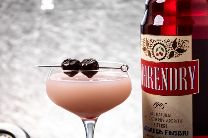 A cocktail garnished with Amarena Fabbri cherries.