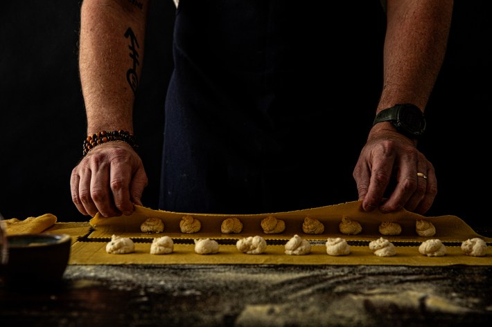 Agnolotti being folded by hand in the Cane Pazzo kitchen