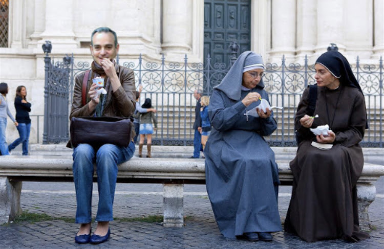 Our Editor-in-Chief enjoying a gelato in Rome "Eat Pray Love" style.