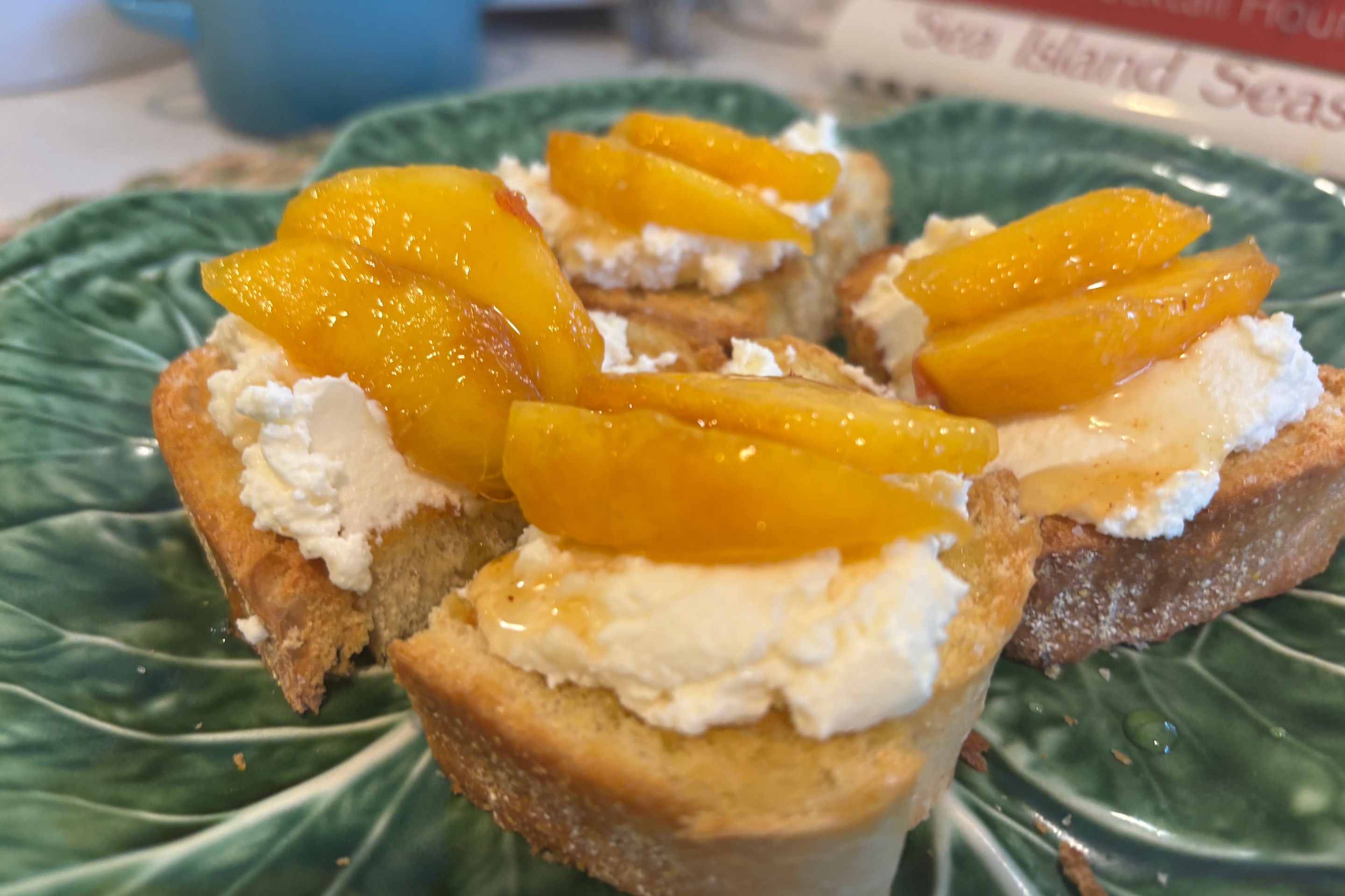 Homemade ricotta crostini with summer peaches.