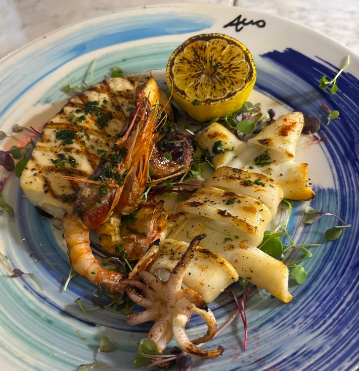 Grilled seafood plate with calamari, swordfish, and shrimp
