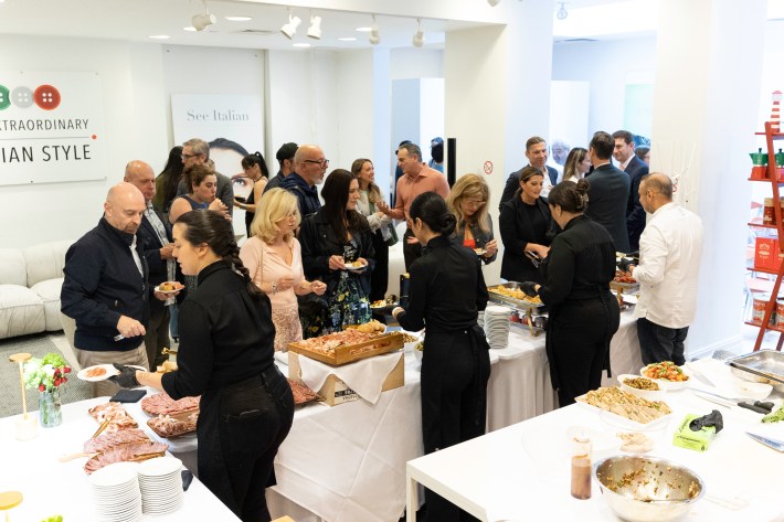 Attendees and participants of the ITA Talks "Grand Finale" enjoying the buffet prepared and served by Chef Fabrizio Facchini and his catering team.