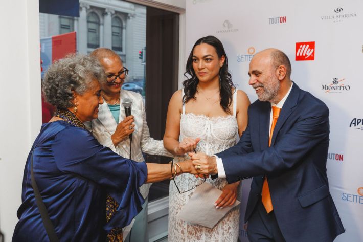 Leah Abraham, Nino Settepani, and Bilena Settepani greeting guests at their bakery